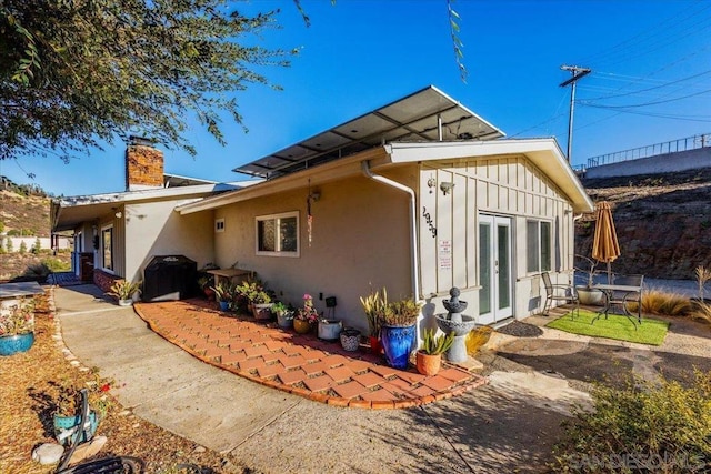 rear view of property with a patio and french doors