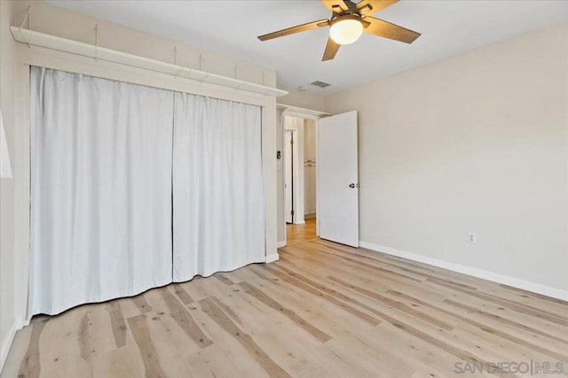 unfurnished bedroom with light hardwood / wood-style flooring and ceiling fan