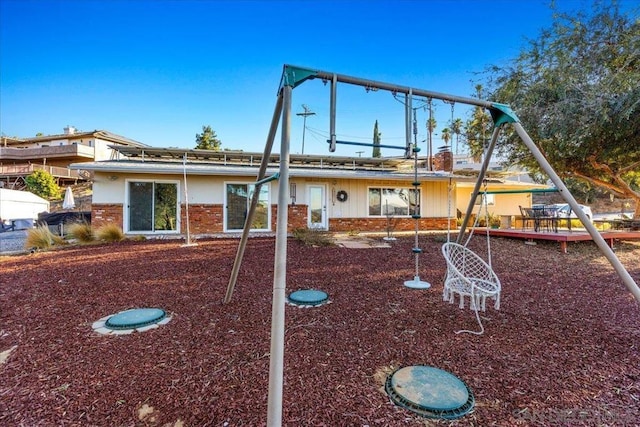 view of front of property featuring a playground