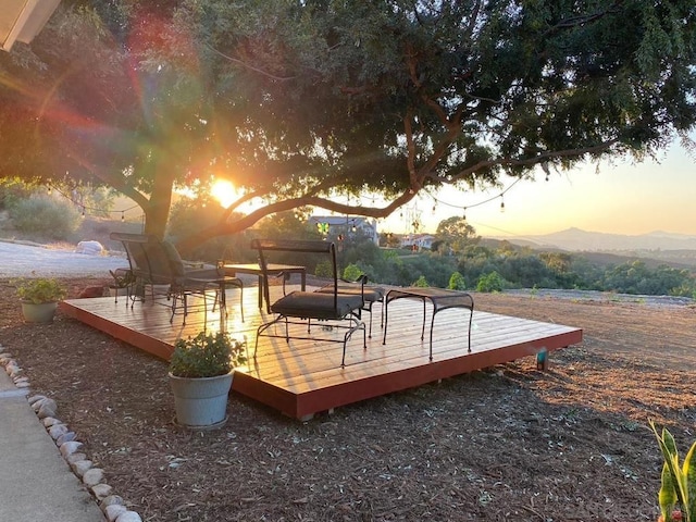 exterior space with a deck with mountain view