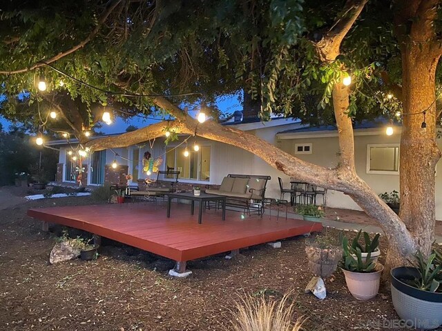 wooden deck featuring outdoor lounge area