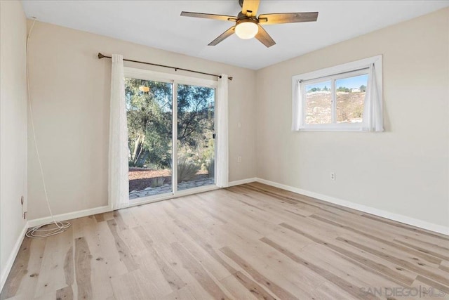 empty room featuring ceiling fan and light wood-type flooring