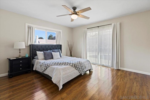 bedroom with dark wood-type flooring and ceiling fan