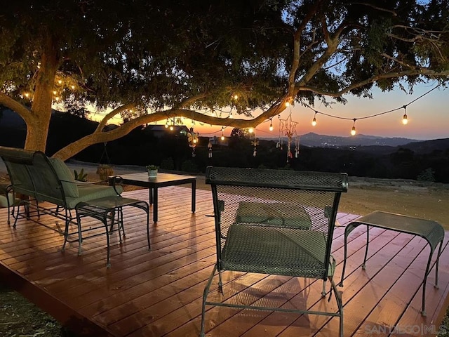 deck at dusk with a mountain view