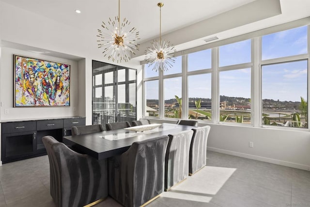 dining space with a notable chandelier