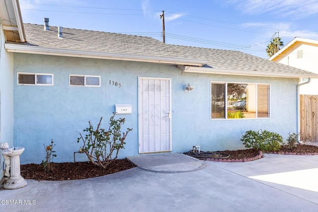 property entrance with a patio