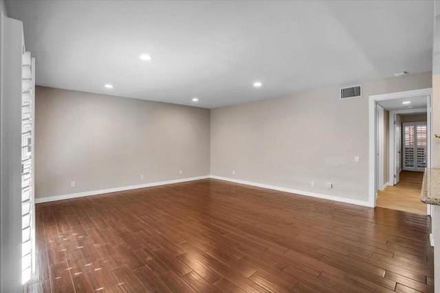 empty room featuring dark hardwood / wood-style floors