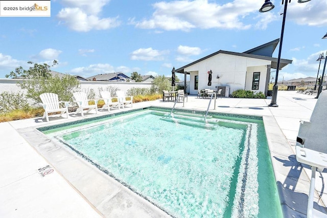 view of pool with a patio area