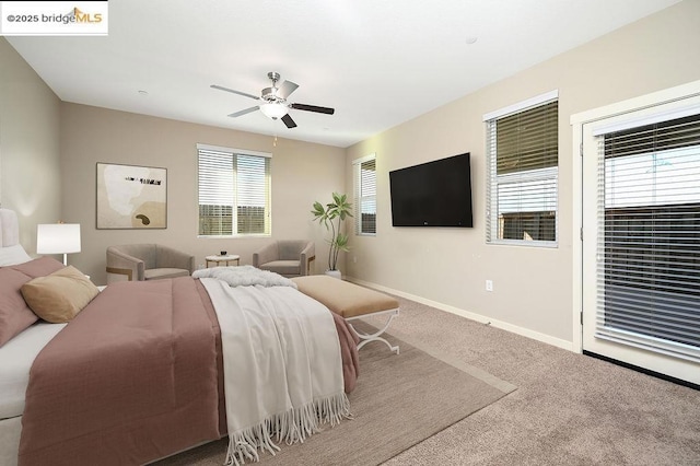 carpeted bedroom featuring ceiling fan and access to outside