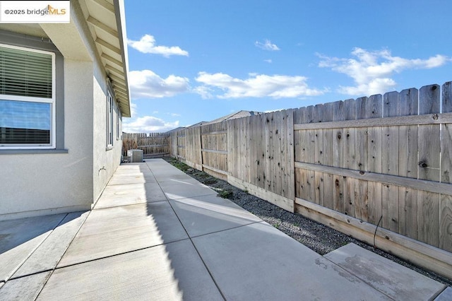 view of side of home with a patio area