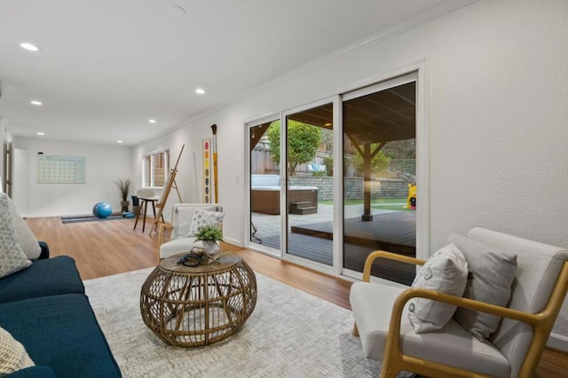 living room featuring ornamental molding and hardwood / wood-style flooring