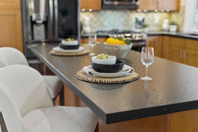 kitchen with tasteful backsplash and stove