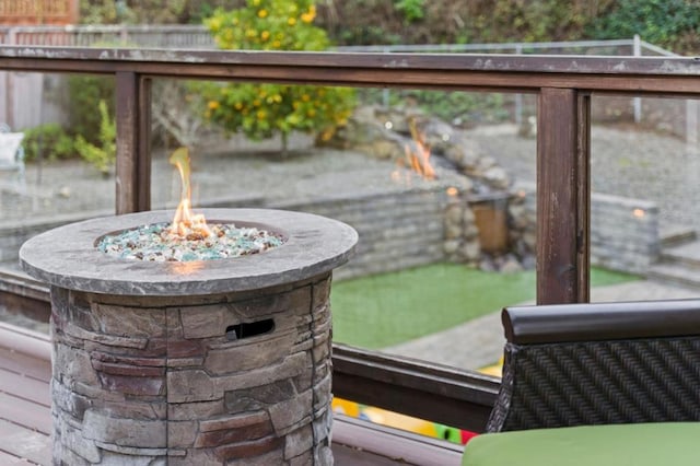 exterior details featuring an outdoor fire pit