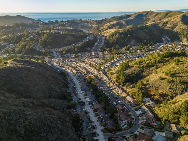 birds eye view of property featuring a water and mountain view