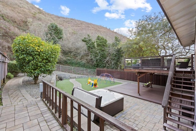 view of patio with a deck with mountain view