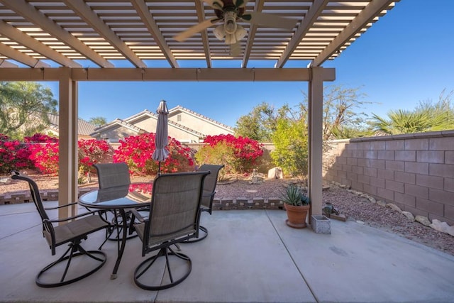 view of patio with ceiling fan and a pergola