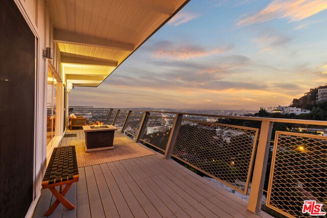 balcony at dusk with outdoor lounge area