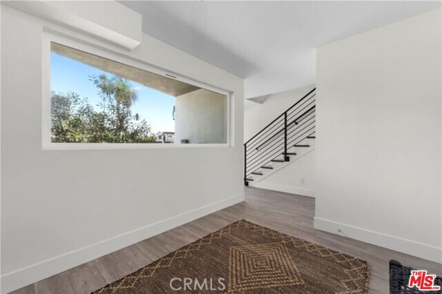 interior space with hardwood / wood-style flooring