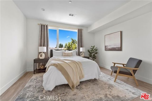 bedroom with light hardwood / wood-style flooring