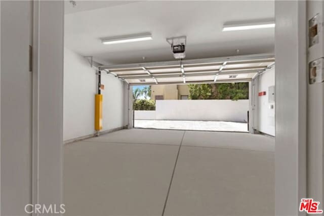 garage featuring a garage door opener