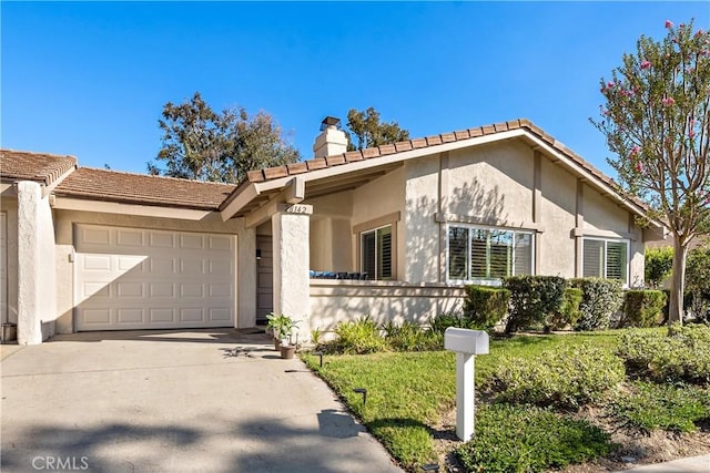 single story home with a garage