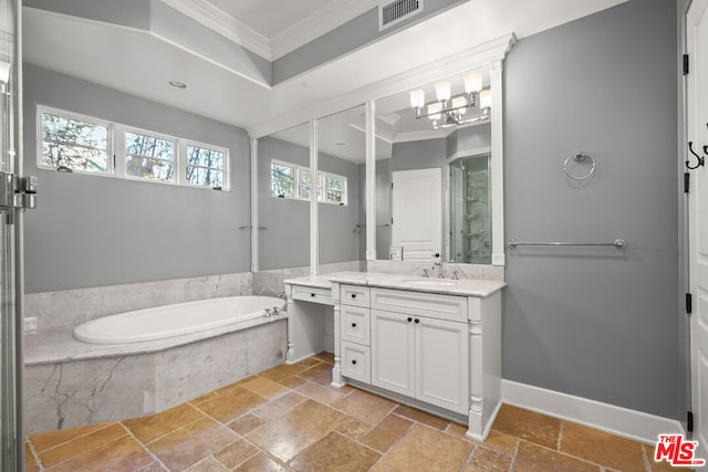 bathroom featuring tiled bath, vanity, a wealth of natural light, and crown molding