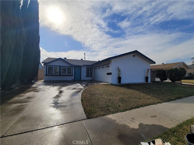 single story home with a front lawn and a garage