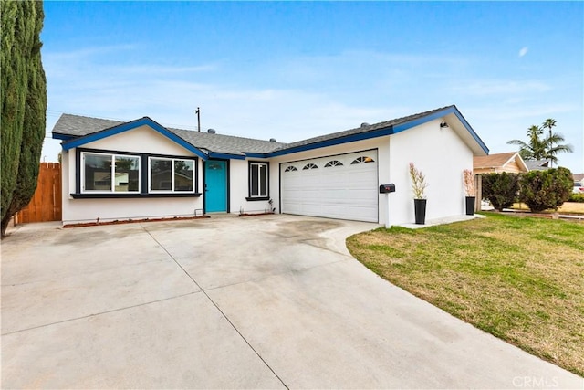 ranch-style home with a garage and a front yard