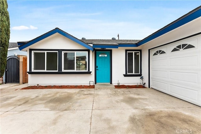 ranch-style home featuring a garage