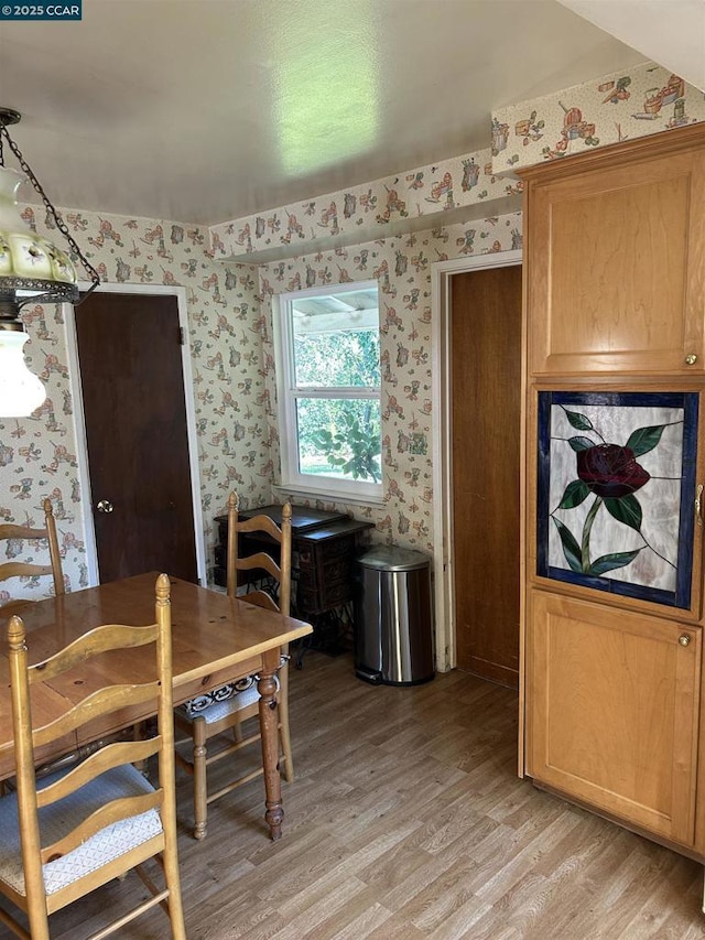 dining space with light wood-type flooring