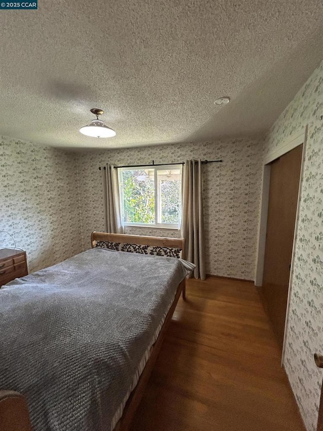 unfurnished bedroom featuring hardwood / wood-style flooring