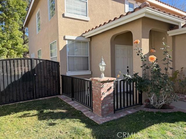 doorway to property featuring a yard