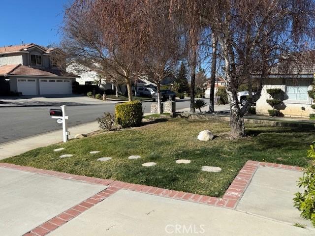 view of yard featuring a garage