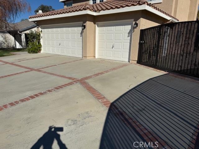 view of property exterior with a garage