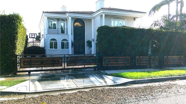 view of front of home with a balcony