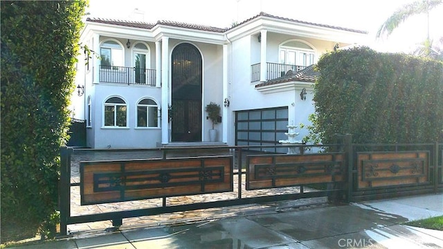 mediterranean / spanish-style house with a balcony