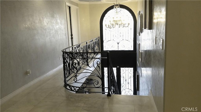 entrance foyer with a chandelier