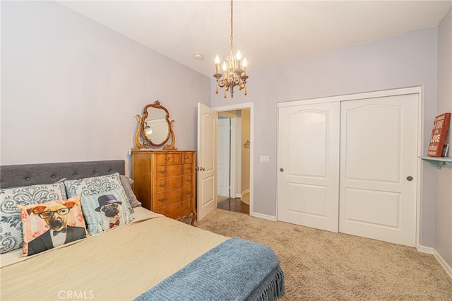 bedroom with carpet, a closet, and a chandelier