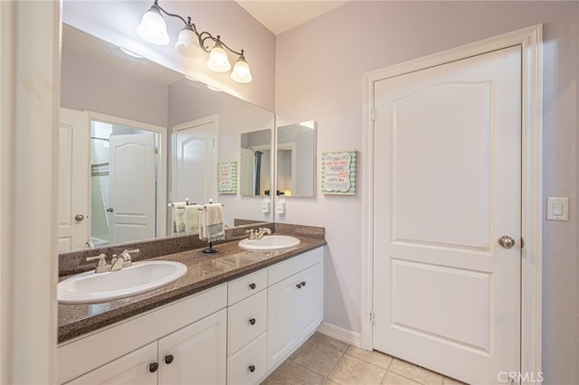 bathroom featuring vanity and tile patterned flooring