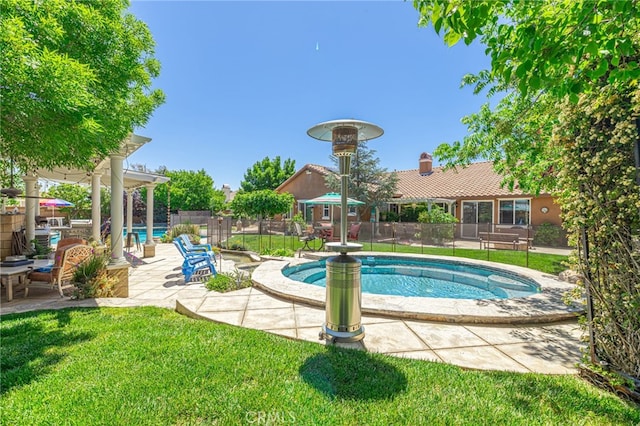 view of swimming pool featuring a patio area and a lawn