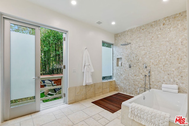 bathroom with separate shower and tub