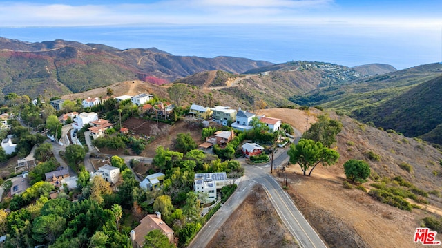 aerial view featuring a water and mountain view