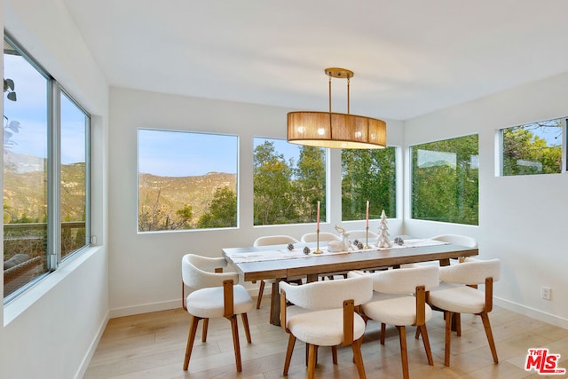 sunroom featuring a mountain view