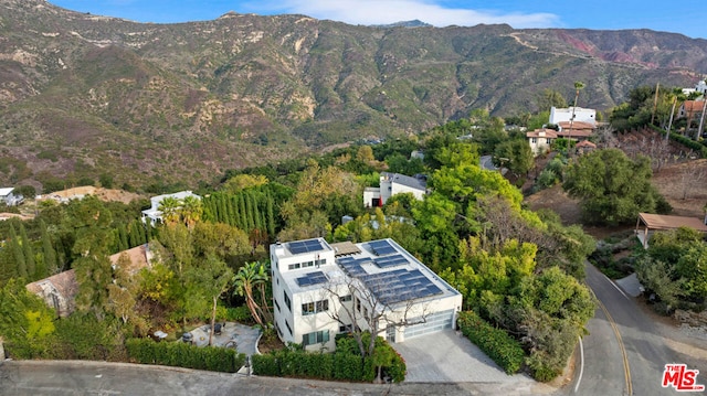 birds eye view of property with a mountain view