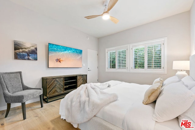 bedroom featuring ceiling fan and light hardwood / wood-style flooring