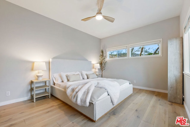 bedroom featuring ceiling fan and light hardwood / wood-style floors