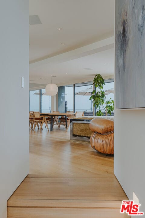 hallway with hardwood / wood-style floors