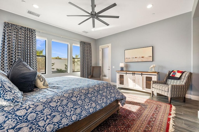 bedroom with ceiling fan and wood-type flooring