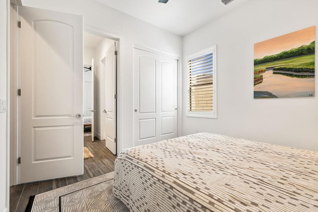 bedroom featuring dark hardwood / wood-style flooring