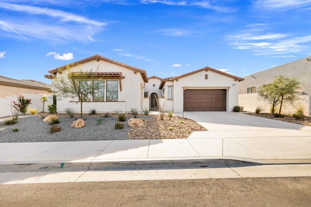 mediterranean / spanish-style house with a garage